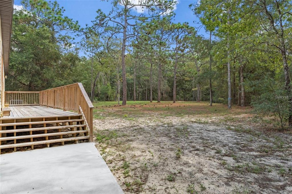 8192 Fort Dade Avenue Brooksville, FL 34601 - Photo 30 of 34 a view of outdoor space with deck and yard