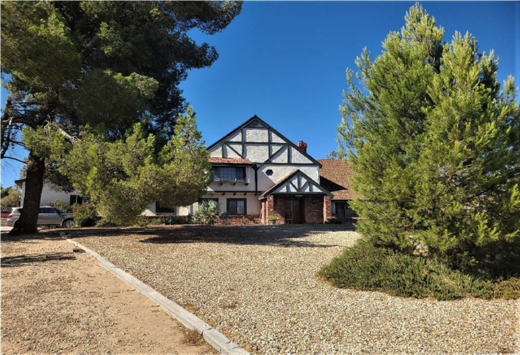 20090 Modoc Road Apple Valley, CA 92308 - Photo 1 of 23 a front view of a house with a yard