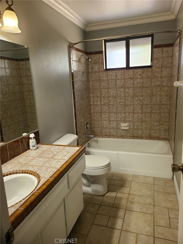 20090 Modoc Road Apple Valley, CA 92308 - Photo 11 of 23 a bathroom with a sink a toilet and bathtub