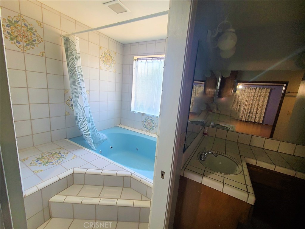 20090 Modoc Road Apple Valley, CA 92308 - Photo 23 of 23 a bathroom with a sink and shower