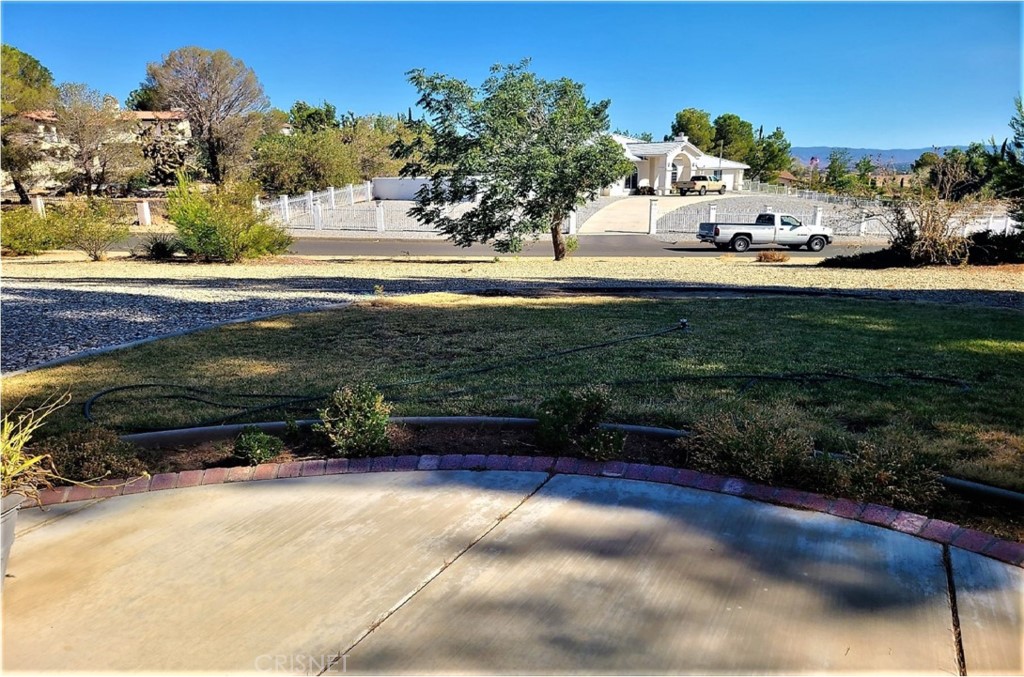 20090 Modoc Road Apple Valley, CA 92308 - Photo 3 of 23 a view of a garden with cars parked