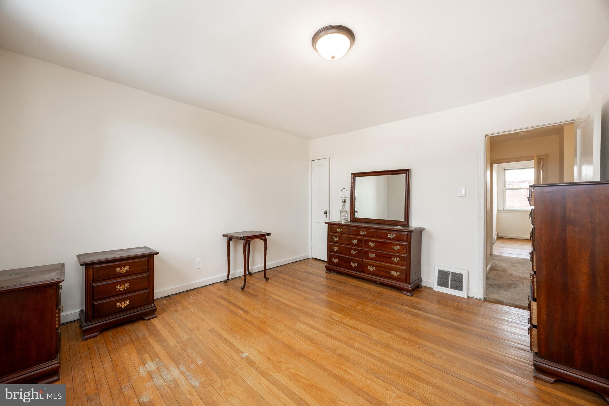 3128 Disston Street Philadelphia, PA 19149 - Photo 13 of 20 a bedroom with furniture and wooden floor