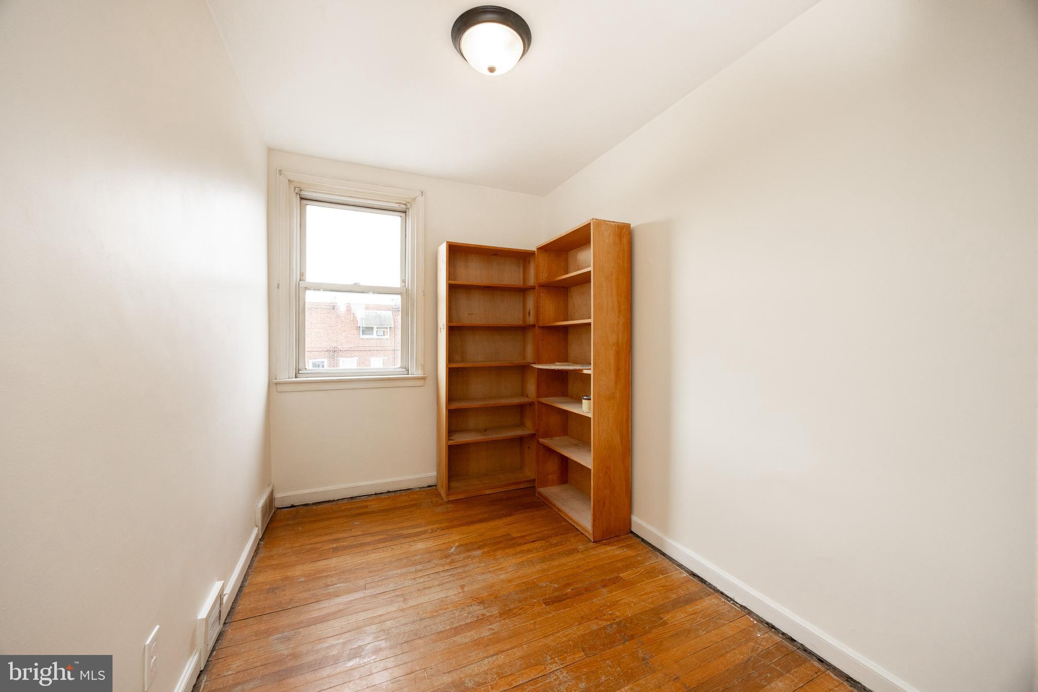 3128 Disston Street Philadelphia, PA 19149 - Photo 18 of 20 a view of walk in closet with empty racks