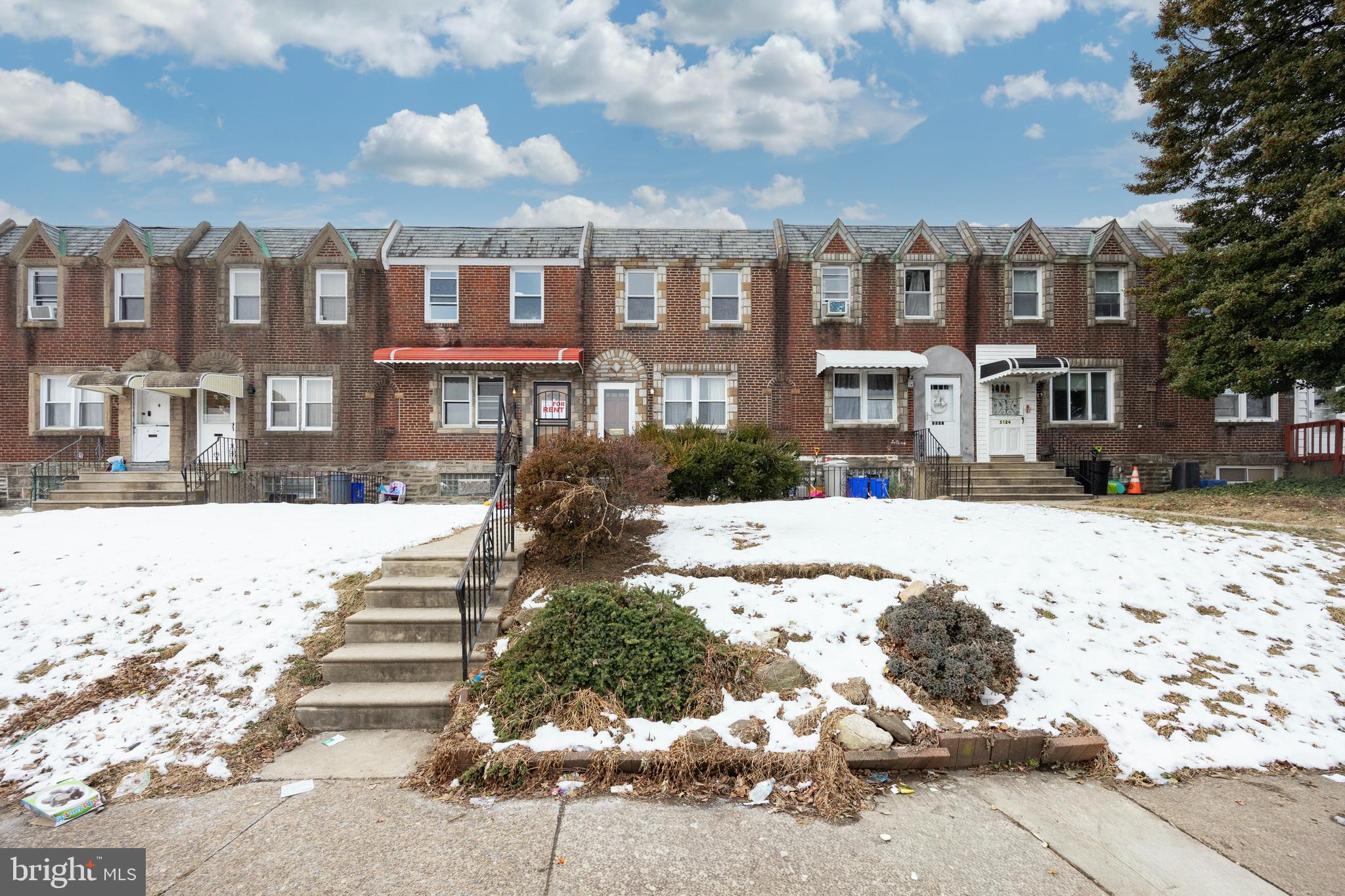 3128 Disston Street Philadelphia, PA 19149 - Photo 2 of 20 a front view of a multi story building
