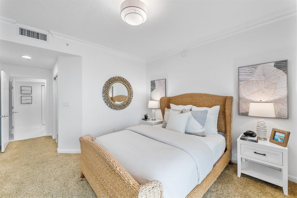 100 South Birch Road, Unit 2403 Fort Lauderdale, FL 33316 - Photo 16 of 26 a bedroom with a bed and a lamp