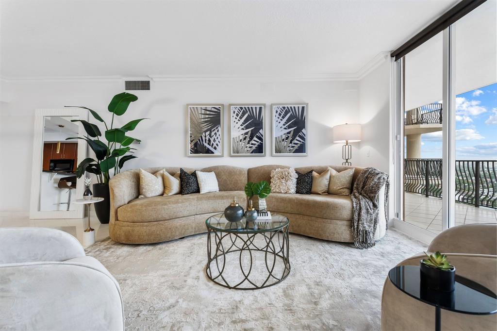 100 South Birch Road, Unit 2403 Fort Lauderdale, FL 33316 - Photo 4 of 26 a living room with furniture potted plant and a large window