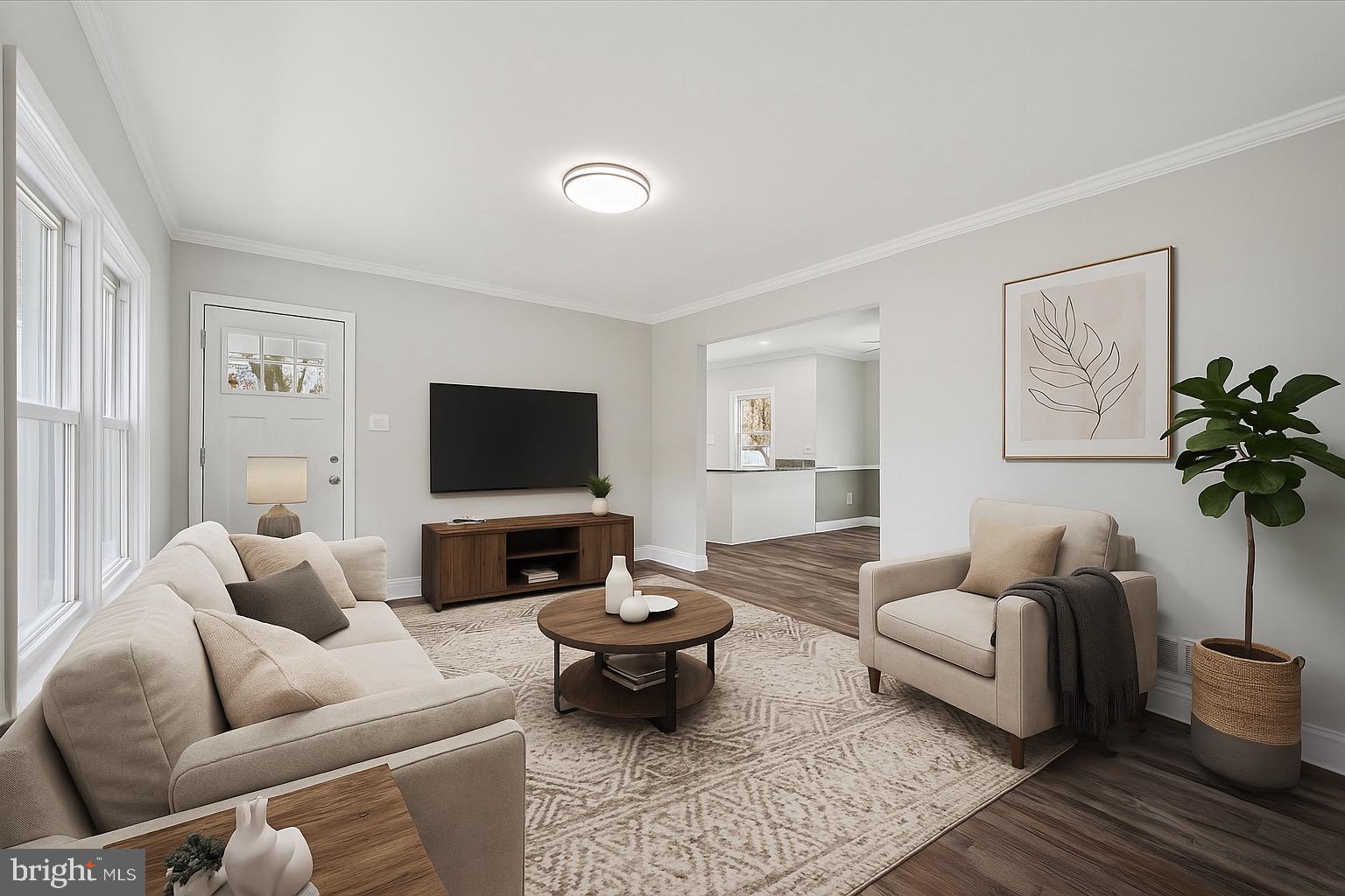 1721 Naamans Creek Road Upper Chichester, PA 19061 - Photo 11 of 33 a living room with furniture wooden floor and a flat screen tv