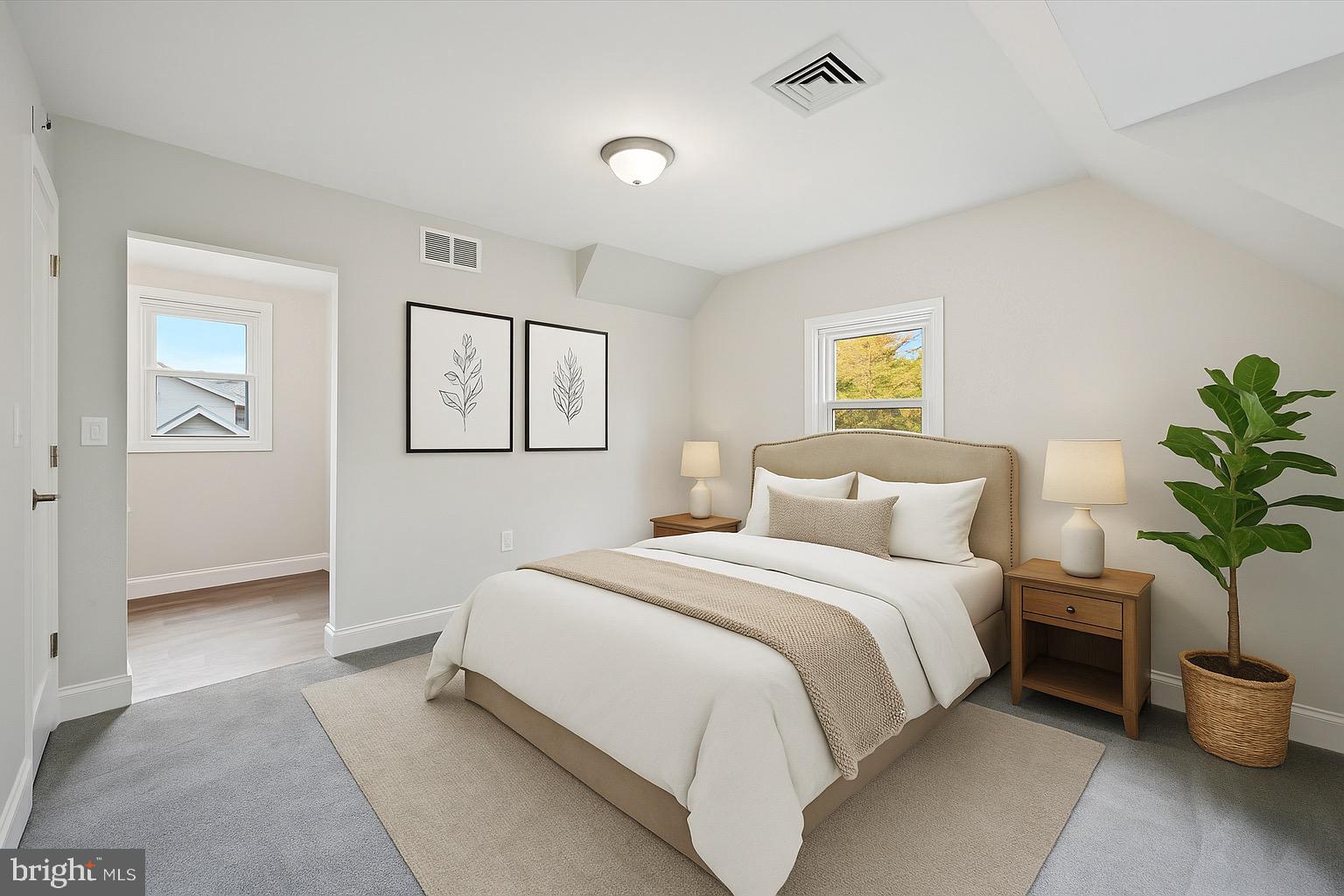 1721 Naamans Creek Road Upper Chichester, PA 19061 - Photo 19 of 33 a bedroom with a large bed and a painting on the wall