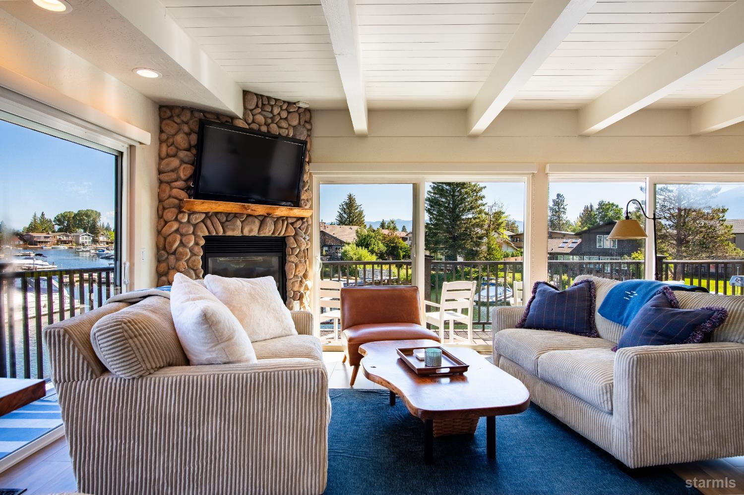 2081 Venice Drive, Unit 280 South Lake Tahoe, CA 96150 - Photo 12 of 37 a living room with furniture fireplace and a large window