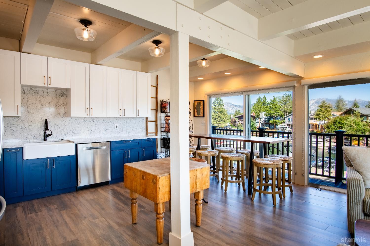 2081 Venice Drive, Unit 280 South Lake Tahoe, CA 96150 - Photo 19 of 37 a kitchen with stainless steel appliances granite countertop wooden floors and view living room
