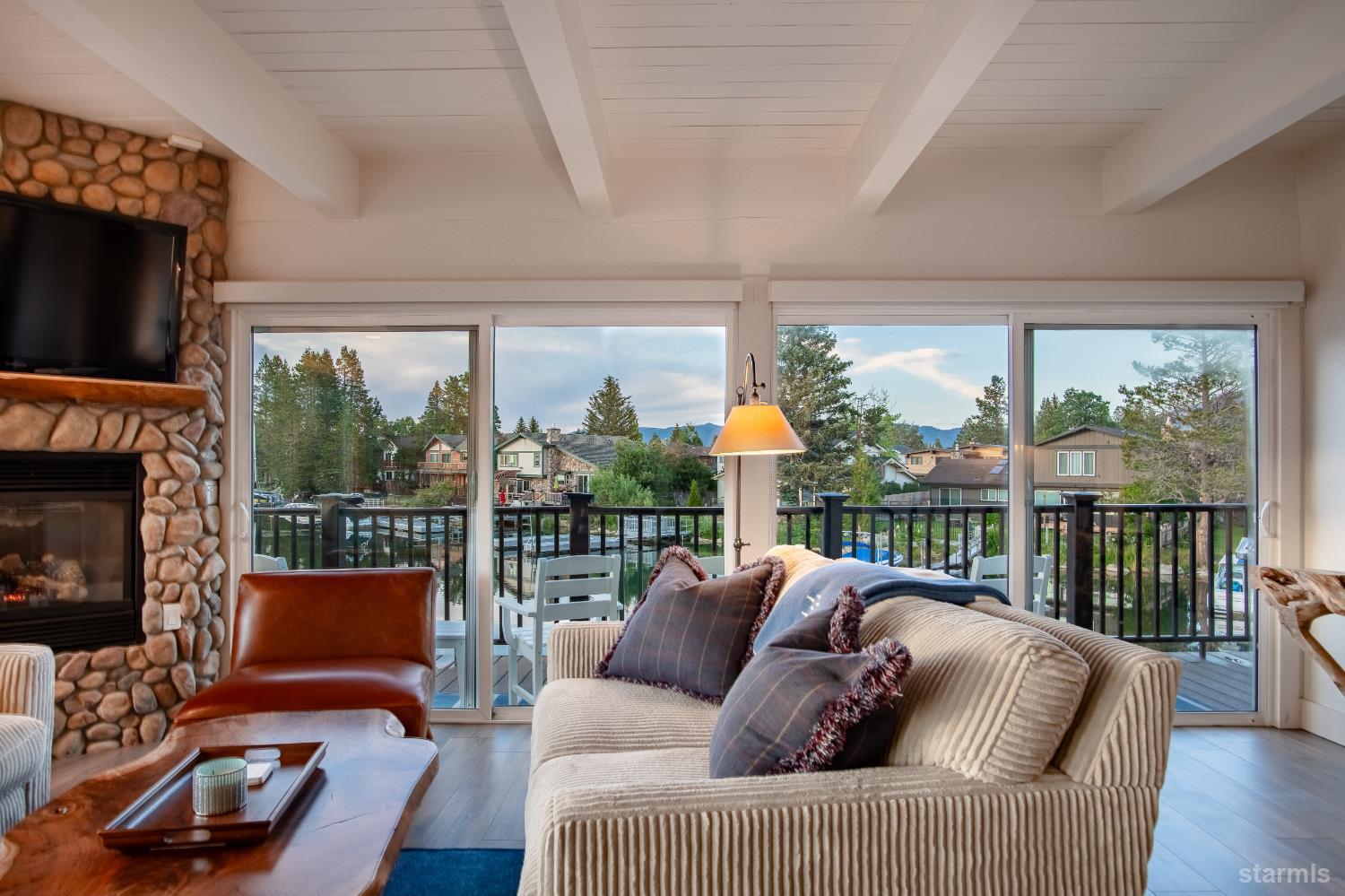 2081 Venice Drive, Unit 280 South Lake Tahoe, CA 96150 - Photo 20 of 37 a living room with furniture a flat screen tv and a fireplace