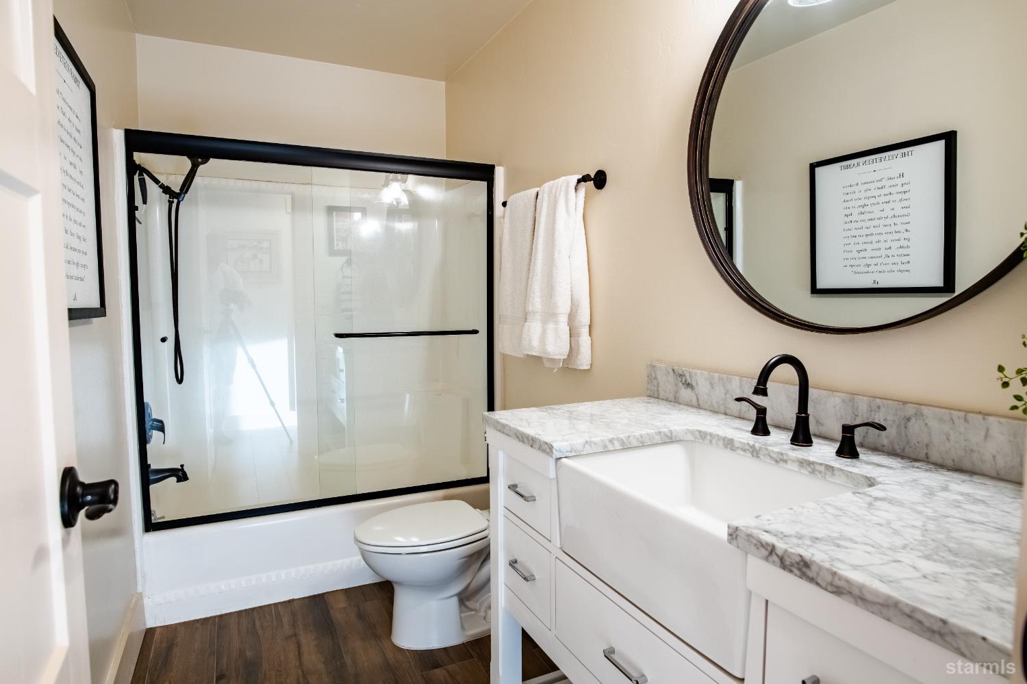 2081 Venice Drive, Unit 280 South Lake Tahoe, CA 96150 - Photo 32 of 37 a bathroom with a granite countertop sink mirror vanity and toilet