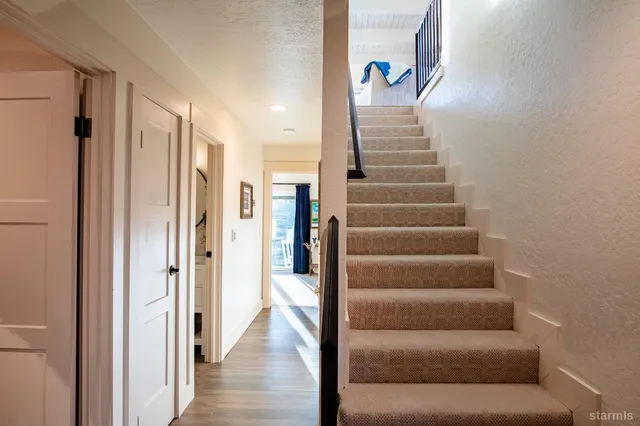 a view of a lake with couches chairs and a table
