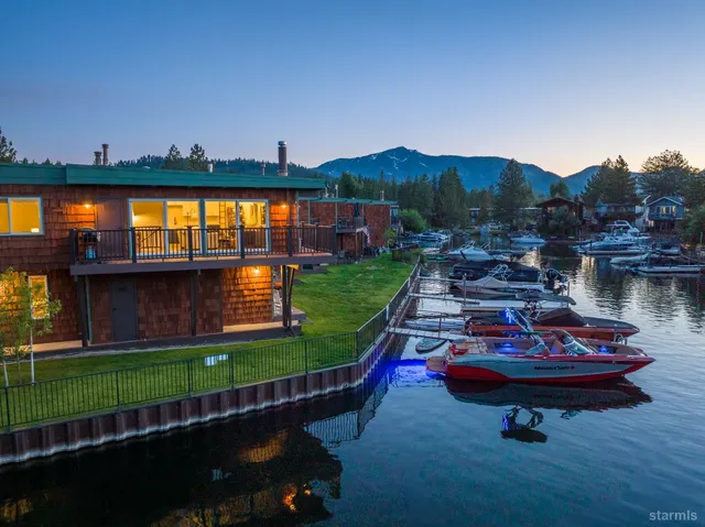 a backyard of a house with lots of green space and fountain