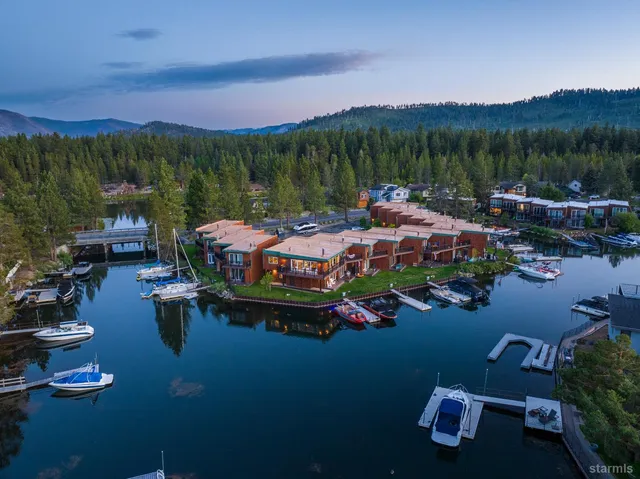 a view of a balcony with chairs and a fireplace
