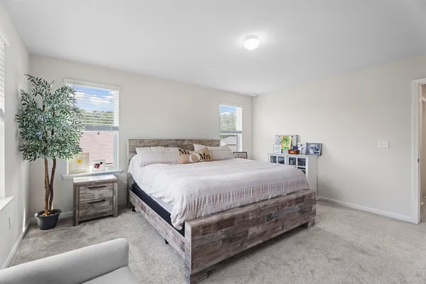 a spacious bathroom with a granite countertop sink a mirror and a