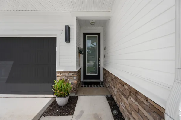 a house view with swimming pool and garden space