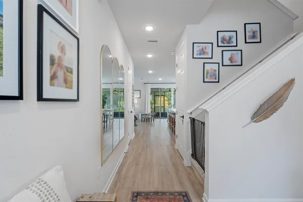 a very nice looking room with wooden floor and a bathroom