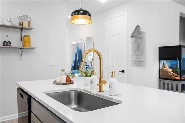 a kitchen with a sink stove and refrigerator