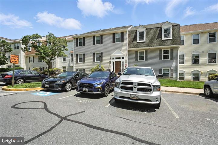 20315 Beaconfield Terrace, Unit 202 Germantown, MD 20874 - Photo 24 of 25 a car parked in front of a house
