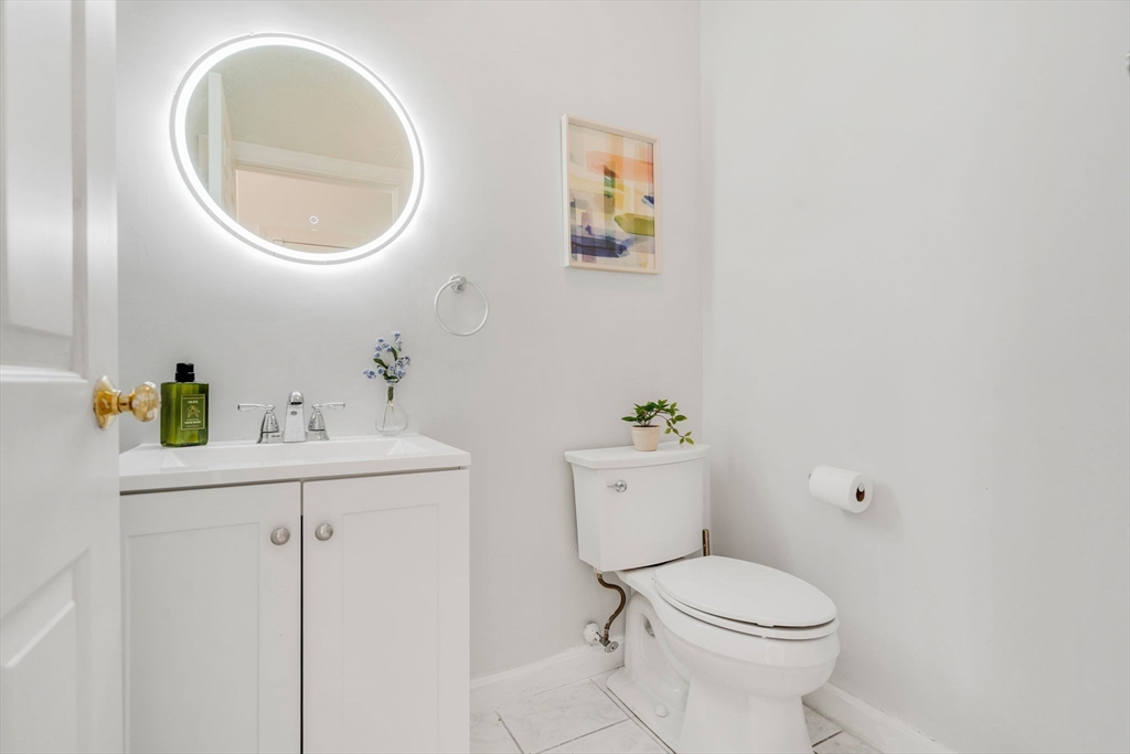 153 Walpole Street Dover, MA 02030 - Photo 14 of 42 a white toilet sitting next to a bathroom sink