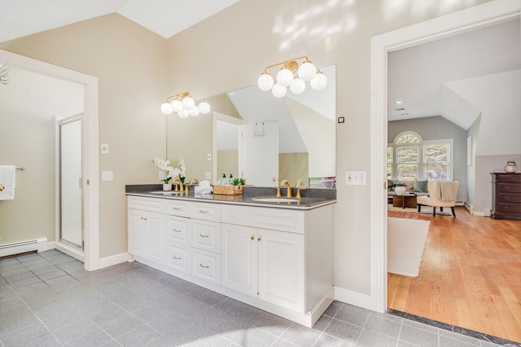 153 Walpole Street Dover, MA 02030 - Photo 20 of 42 a spacious bathroom with a granite countertop sink a mirror and a bathtub