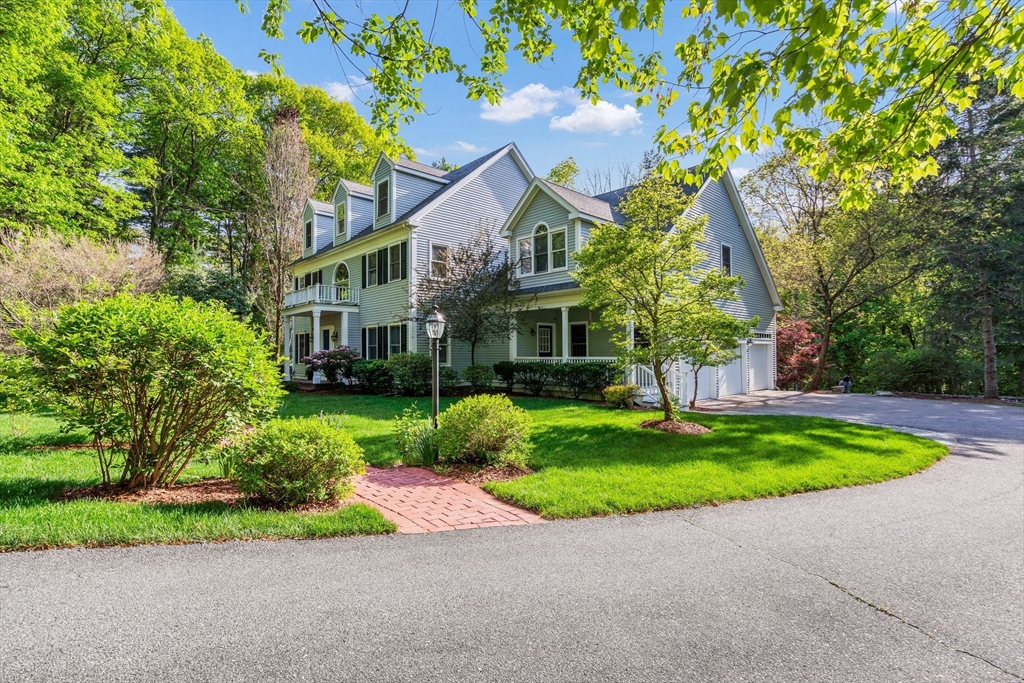 153 Walpole Street Dover, MA 02030 - Photo 2 of 42 a view of a house with a yard and large tree