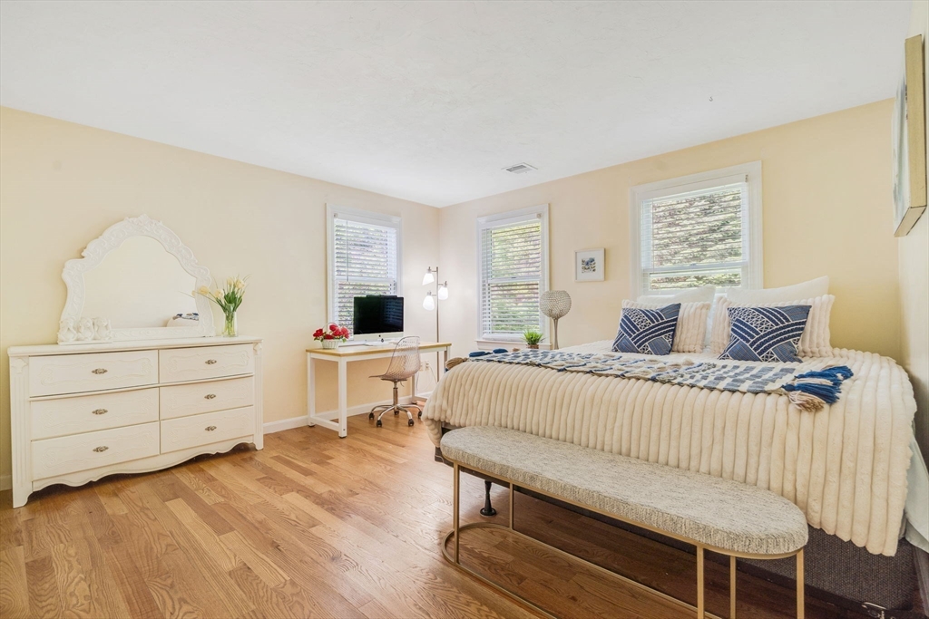 153 Walpole Street Dover, MA 02030 - Photo 21 of 42 a bedroom with a bed and a dresser