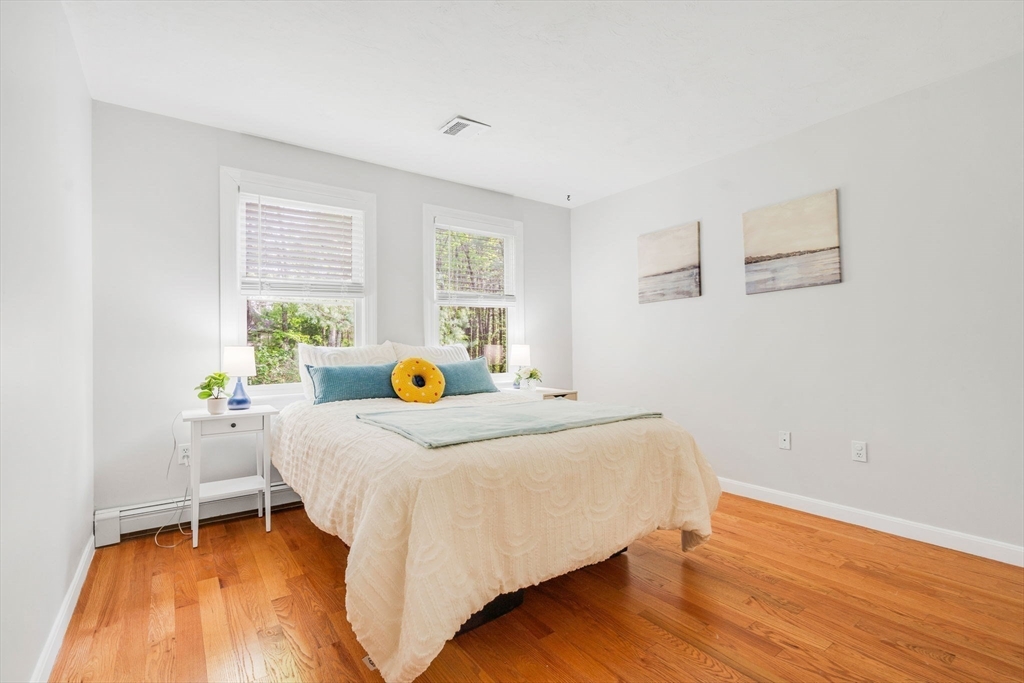 153 Walpole Street Dover, MA 02030 - Photo 22 of 42 a bedroom with a bed and a table