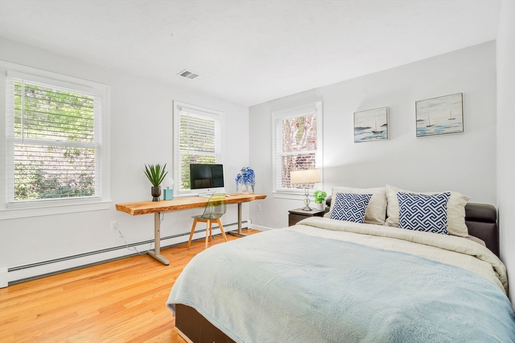 153 Walpole Street Dover, MA 02030 - Photo 23 of 42 a bedroom with a bed and a window