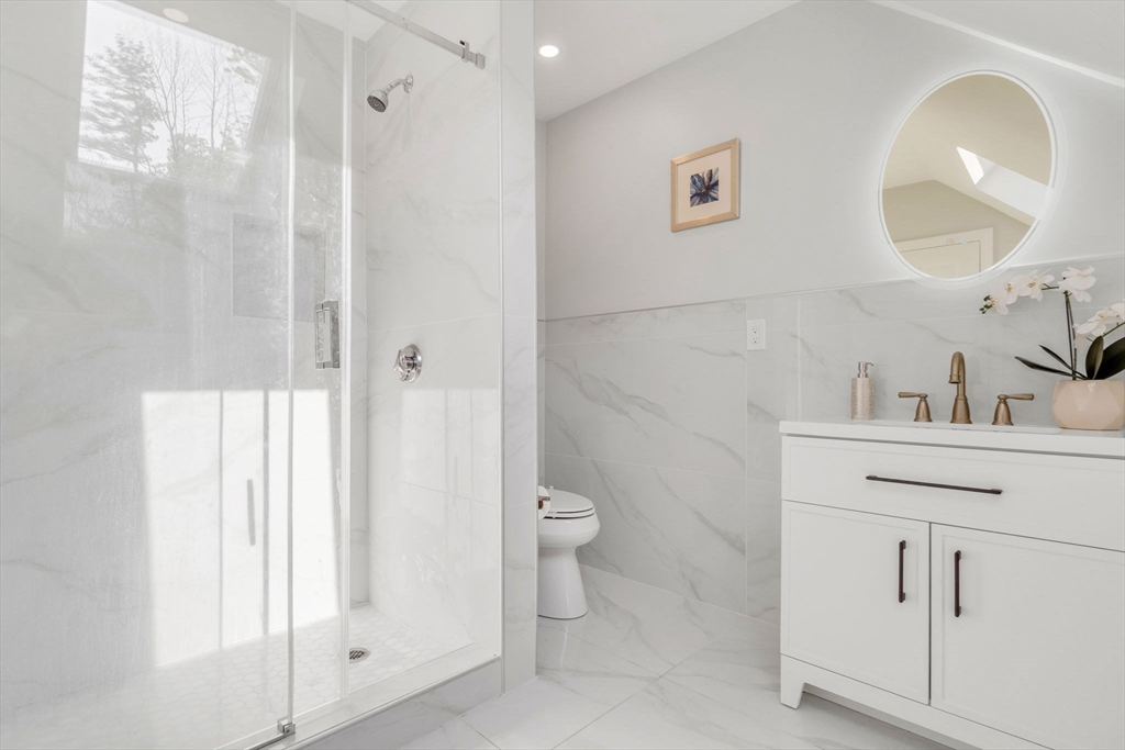 153 Walpole Street Dover, MA 02030 - Photo 28 of 42 a bathroom with a toilet sink and shower