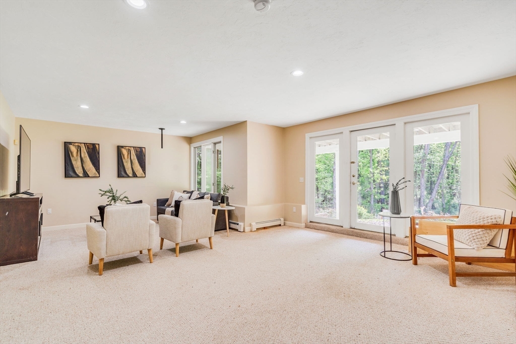 153 Walpole Street Dover, MA 02030 - Photo 29 of 42 a living room with furniture and a large window