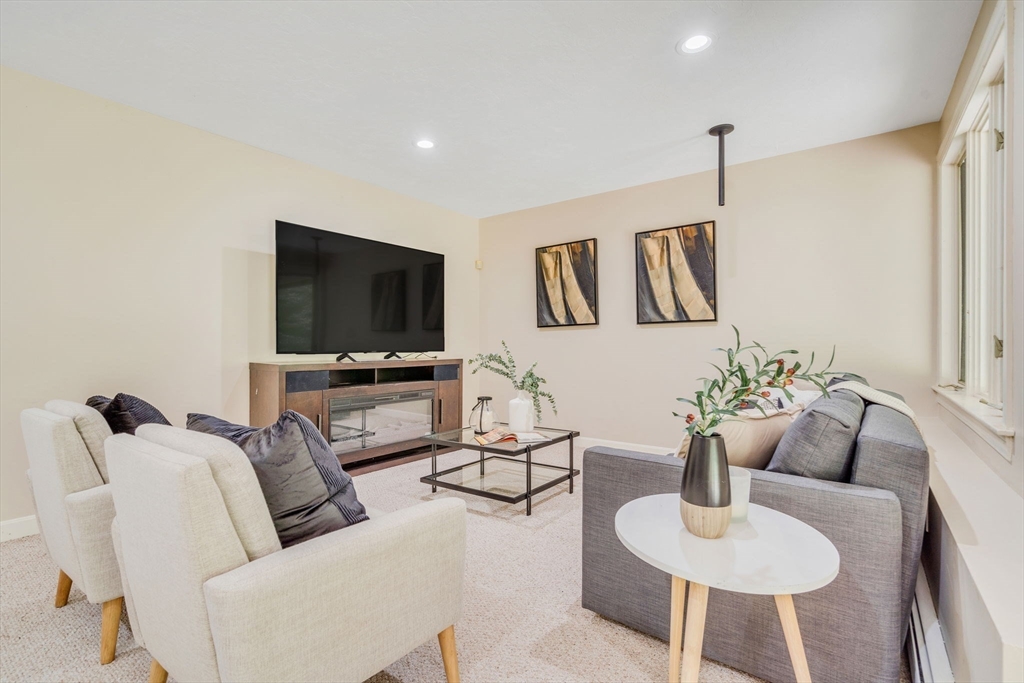 153 Walpole Street Dover, MA 02030 - Photo 30 of 42 a living room with furniture and a flat screen tv