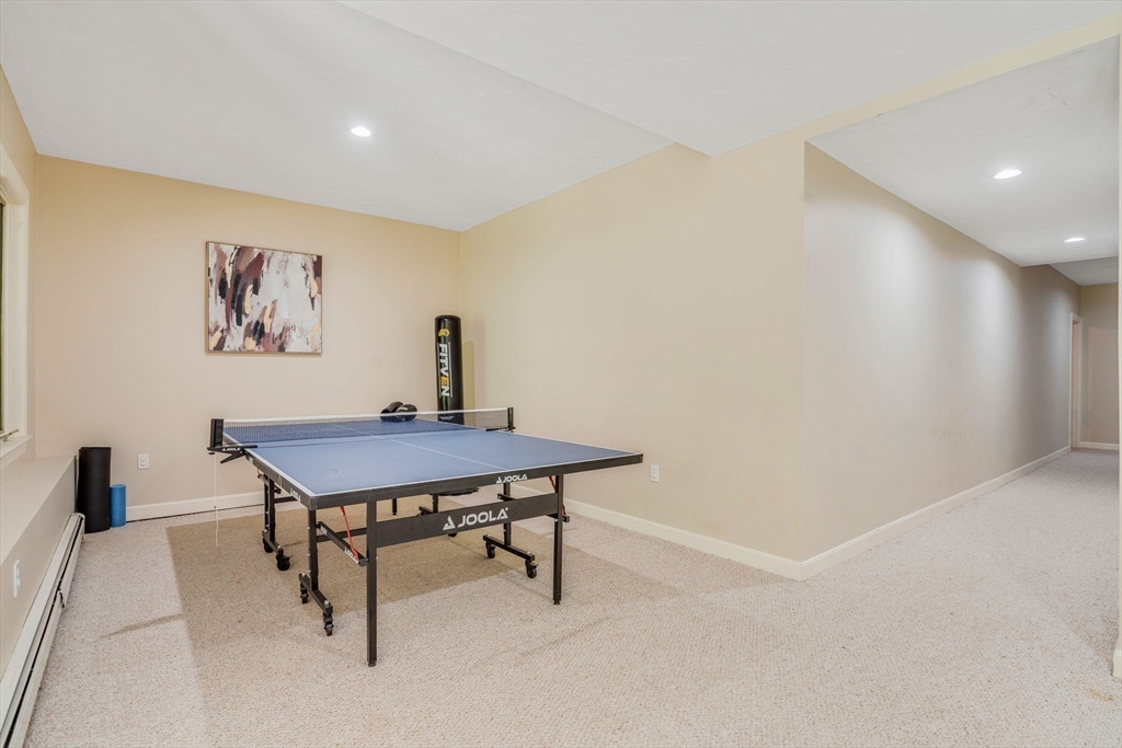 153 Walpole Street Dover, MA 02030 - Photo 31 of 42 a view of a room with a table and chairs