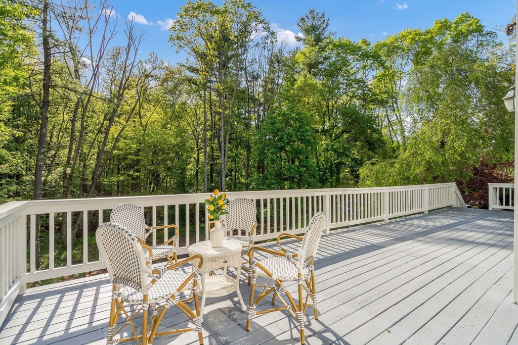 153 Walpole Street Dover, MA 02030 - Photo 35 of 42 a view of a chair and table on the wooden floor