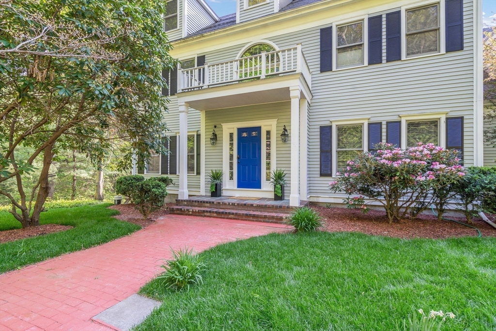 153 Walpole Street Dover, MA 02030 - Photo 39 of 42 front view of a house with a yard