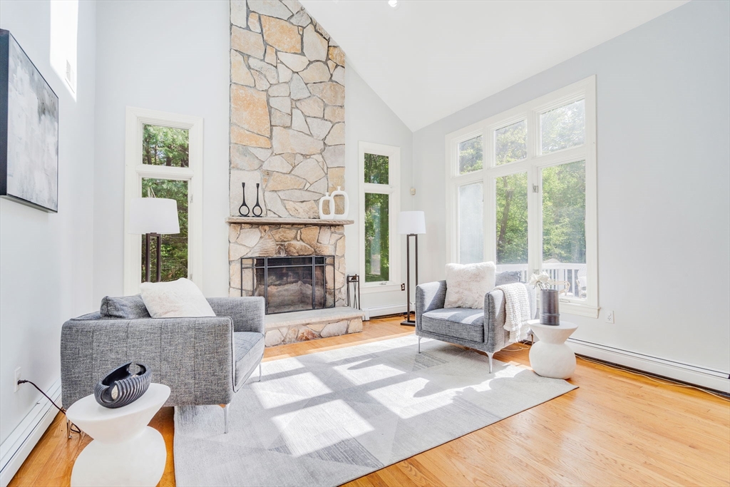 153 Walpole Street Dover, MA 02030 - Photo 4 of 42 a living room with furniture and a fireplace