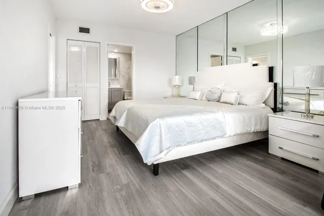 a large white bed in a white room