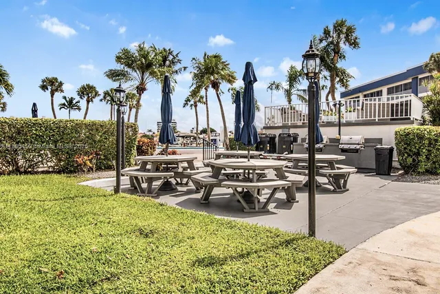 a view of a garden with sitting area
