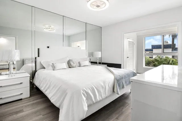 a bedroom with bed and window