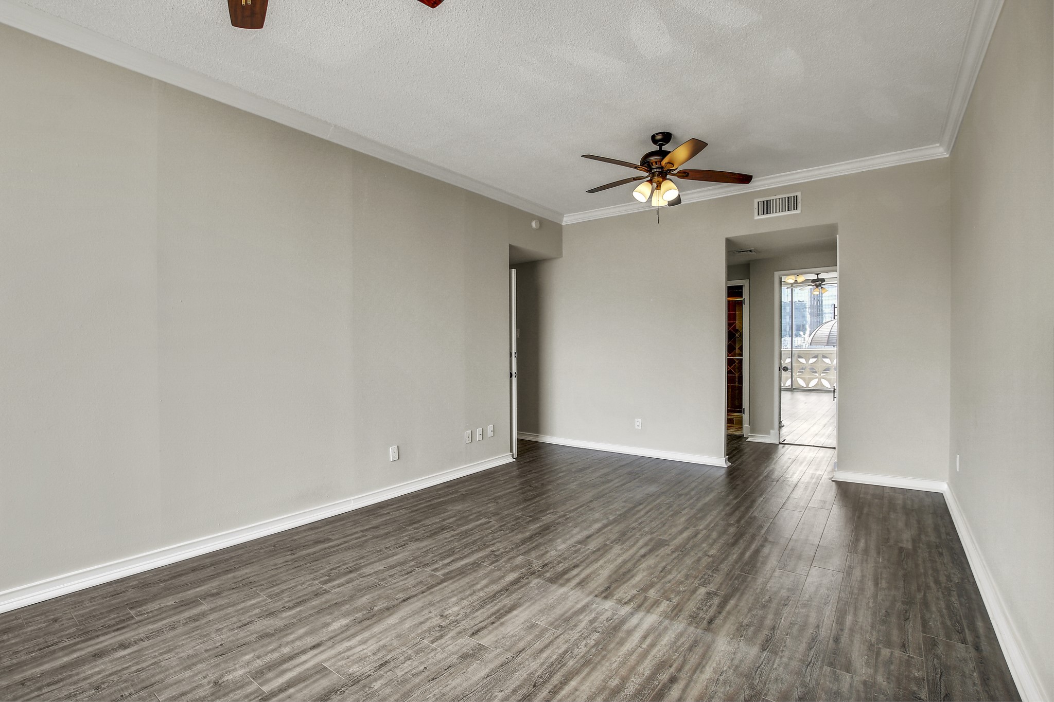 1801 Lavaca Street, Unit 5F Austin, TX 78701 - Photo 16 of 37 wooden floor in an empty room with a window
