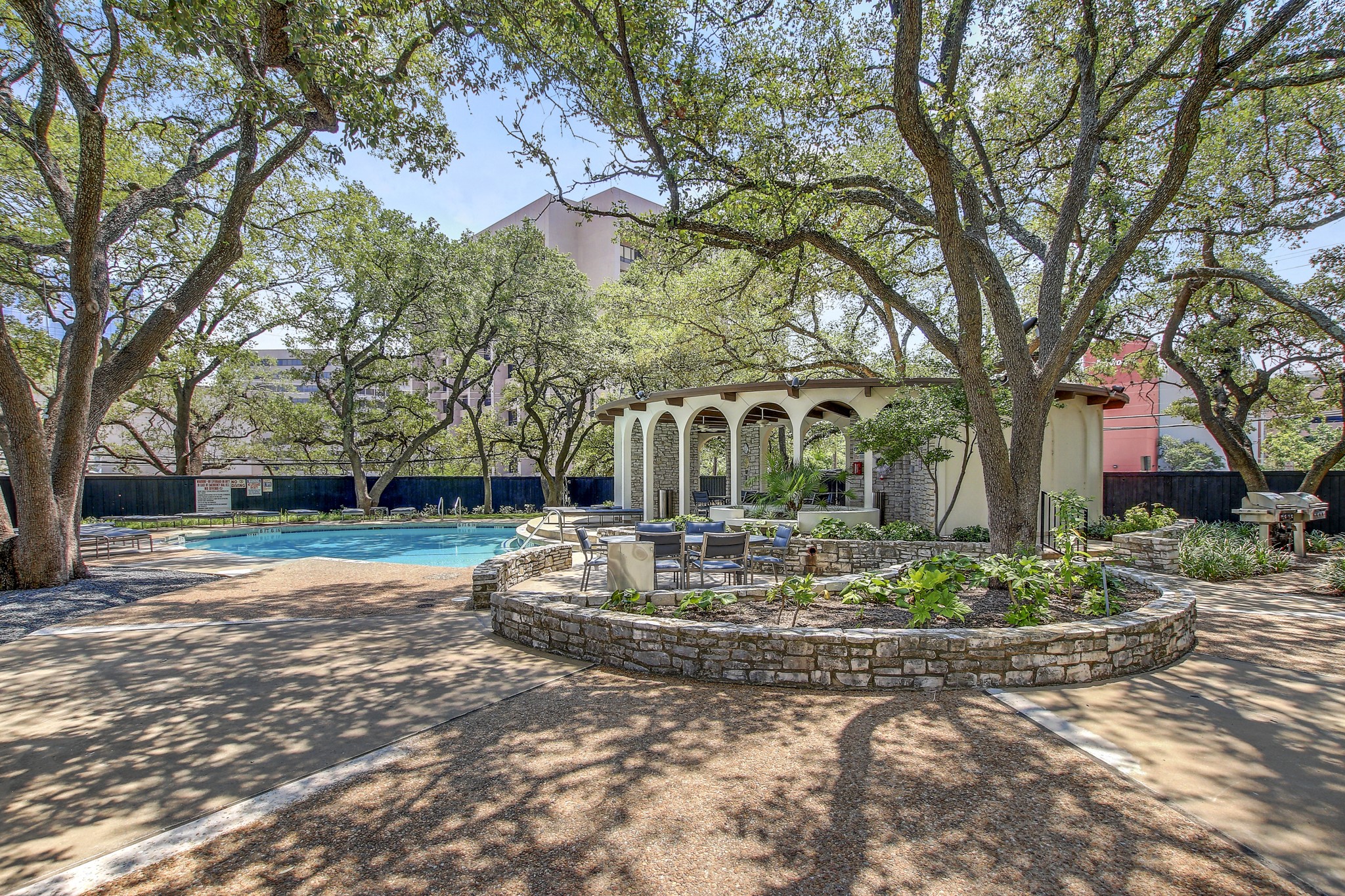 1801 Lavaca Street, Unit 5F Austin, TX 78701 - Photo 26 of 37 a view of a house with garden and trees