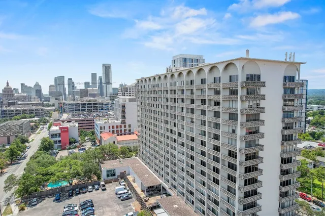 a view of a city with tall buildings