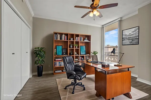 a view of a workspace with furniture and a potted plant