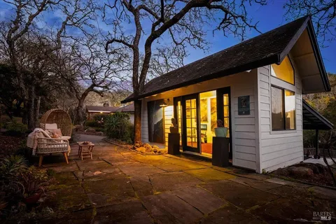 a view of a chairs and table in the patio