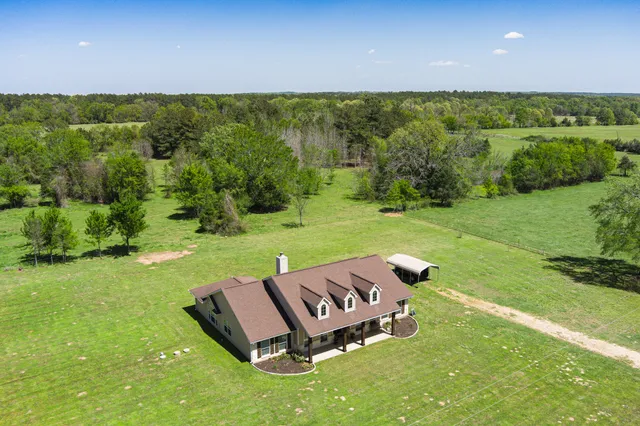an aerial view of a garden with lawn chairs