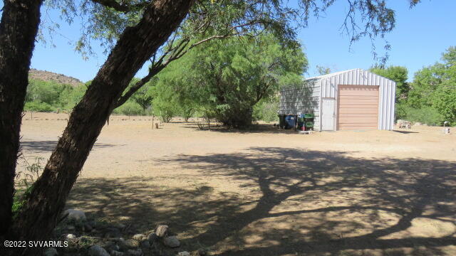 3750 Brocket Ranch Road Rimrock, AZ 86335 - Photo 29 of 48 a view of a yard with a tree