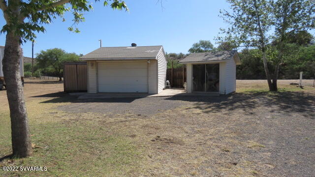 3750 Brocket Ranch Road Rimrock, AZ 86335 - Photo 34 of 48 a view of a house with a yard and garage