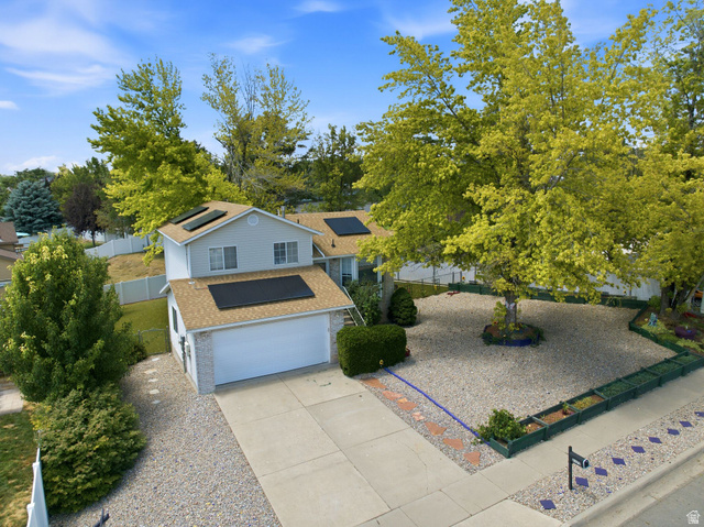 2475 Church Street Layton, UT 84040 - Photo 27 of 27 Two-story residential property featuring a light-colored siding exterior and an attached two-car garage