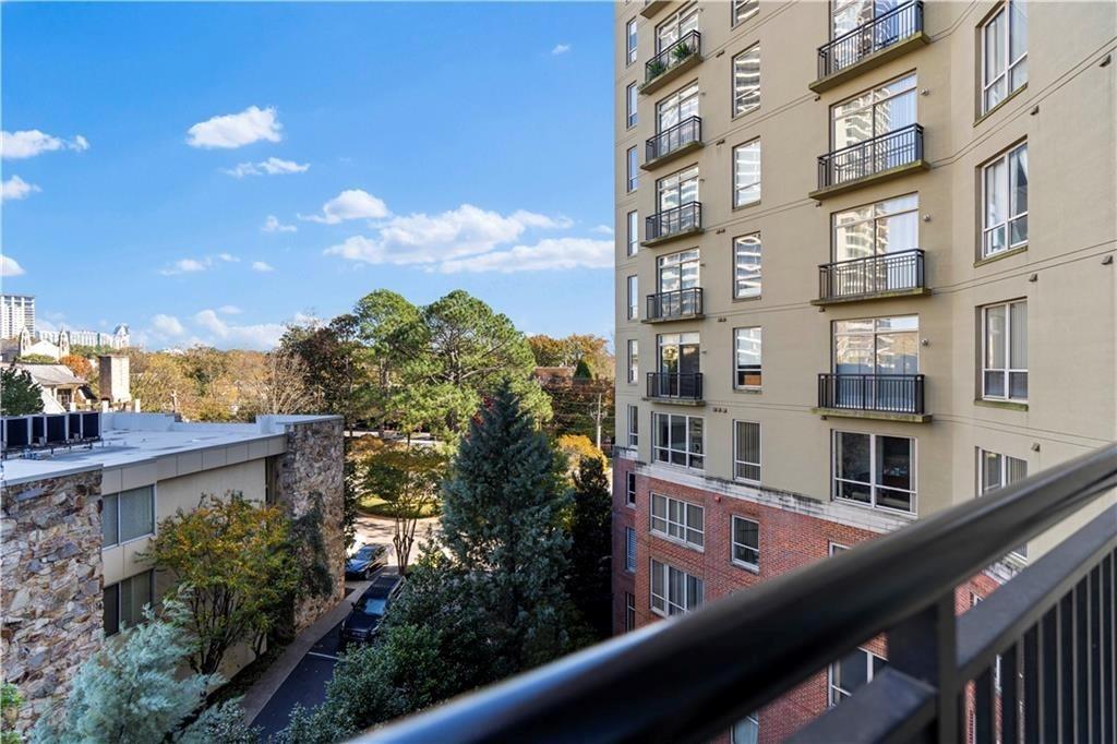 2626 Peachtree Road Northwest, Unit 704 Atlanta, GA 30305 - Photo 15 of 23 a balcony view with tall buildings